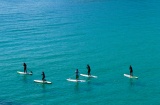 Un grupo practica paddle surf en las aguas de Palamós, en la Costa Brava gerundense Un grupo practica paddle surf en las aguas de Palamós, en la Costa Brava gerundense