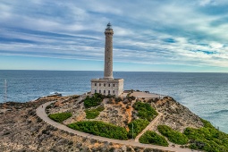 Panoramic view of the famous Mermaid Reef with Cabo de Gata Lighthouse (Almeria, Spain) in the background