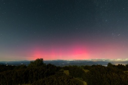 Night landscape featuring pink northern lights over the Montsec Range (Lleida, Spain) Night landscape featuring pink northern lights over the Montsec Range (Lleida, Spain)