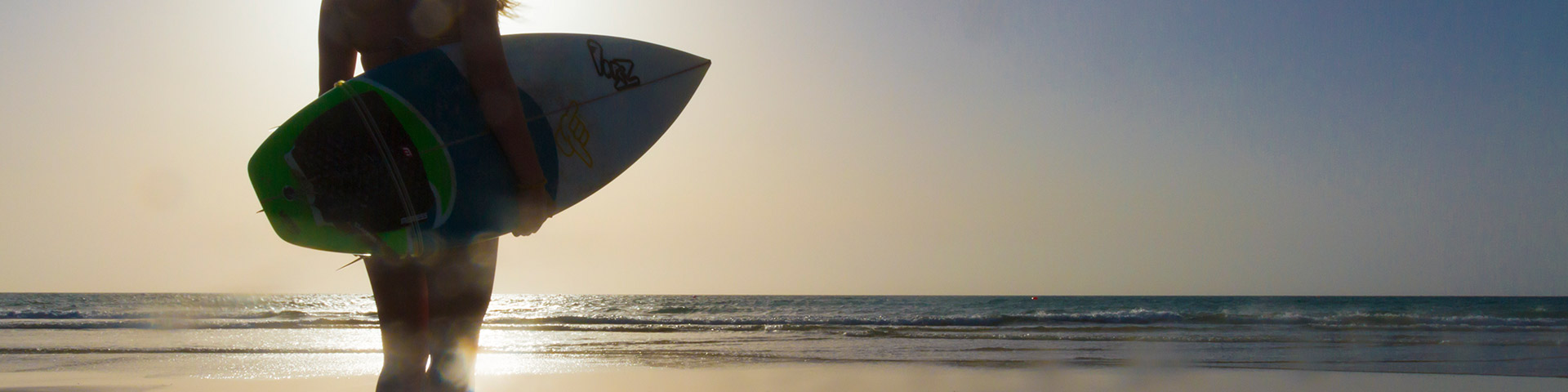 Woman windsurfing on La Barca Beach in Jandía Natural Park (Fuerteventura)