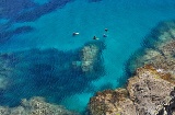 Group of divers in the Cabo de Gata-Níjar Natural Park, in Almeria, known for its rocky formations Group of divers in the Cabo de Gata-Níjar Natural Park, in Almeria, known for its rocky formations