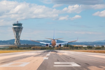 Passenger plane landing at El Prat airport in Barcelona, Spain