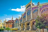 Image of the exterior of Valencia’s Central Market, a work of Valencian Modernism located in the emblematic Ciudad de Brujas square Image of the exterior of Valencia’s Central Market, a work of Valencian Modernism located in the emblematic Ciudad de Brujas square