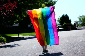lgtb person with flag